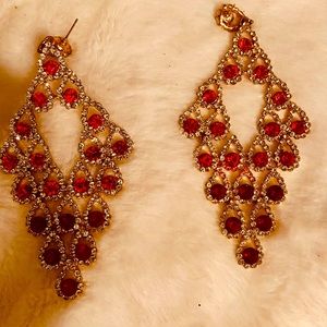 Beautiful blingin diamond studded ruby red  earrings.